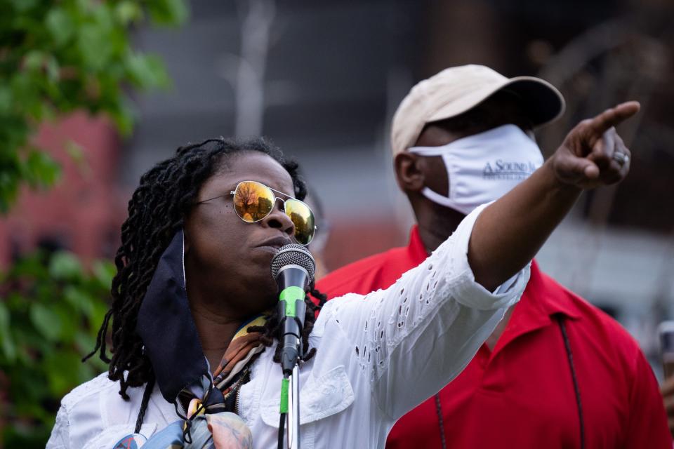 Iris Roley, a member of the Cincinnati Black United Front, speaks to a crowd in April 2021 while reflecting on the killing of Timothy Thomas a decade earlier by a Cincinnati police officer.