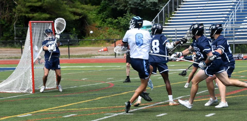 York’s Evan Anastas (6) scores one of his five goals during Saturday’s state championship.