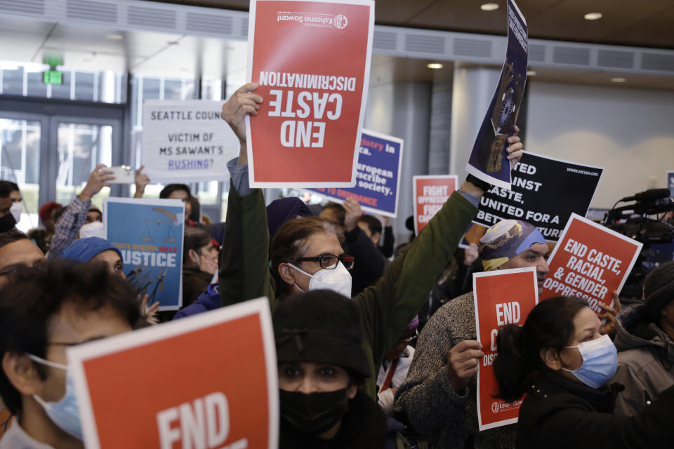 Supporters and opponents of a proposed ordinance to add caste to Seattle's anti-discrimination laws rally at Seattle City Hall, Tuesday, Feb. 21, 2023, in Seattle. Council Member Kshama Sawant proposed the ordinance. (AP Photo/John Froschauer)