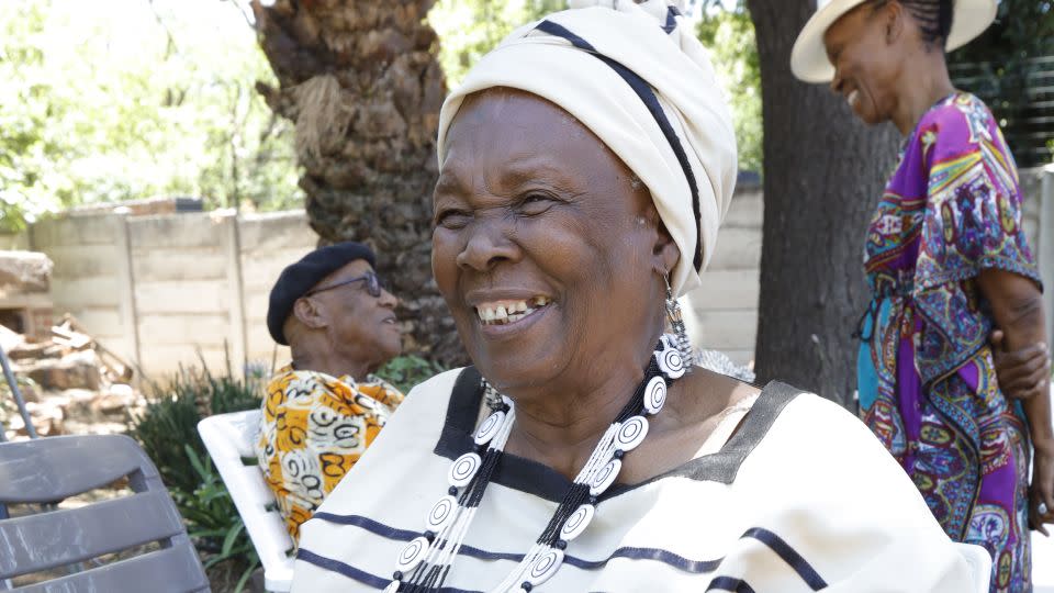 Mmakgabo Helen Sebidi smiles with delight during the celebration of her returned artworks in South Africa, 2023. - Gabriel Baard