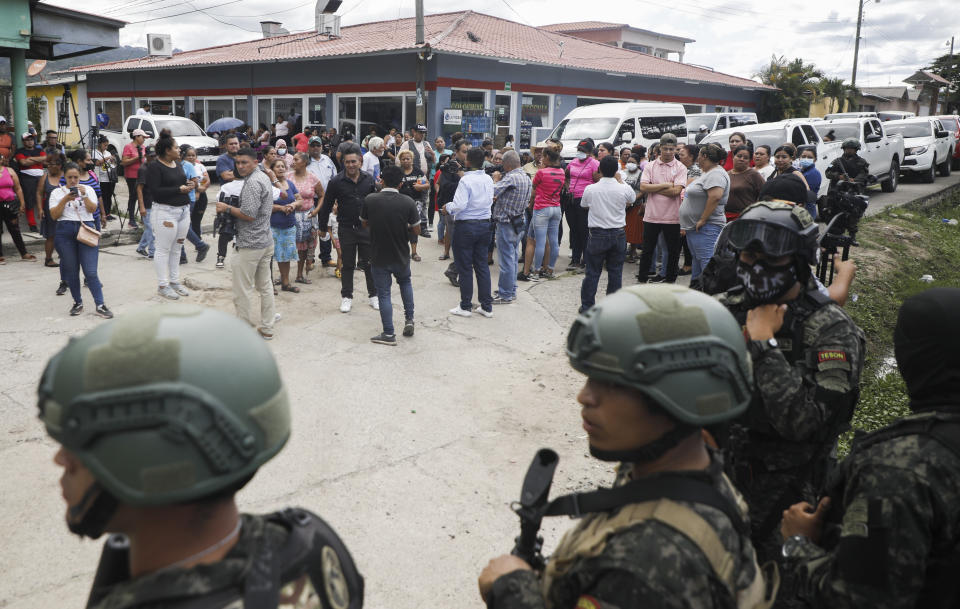 Police guard the entrance to the women's prison in Tamara, on the outskirts of Tegucigalpa, Honduras, Tuesday, June 20, 2023. A riot at the women's prison northwest of the Honduran capital has left at least 41 inmates dead, most of them burned to death, a Honduran police official said. (AP Photo/Elmer Martinez)