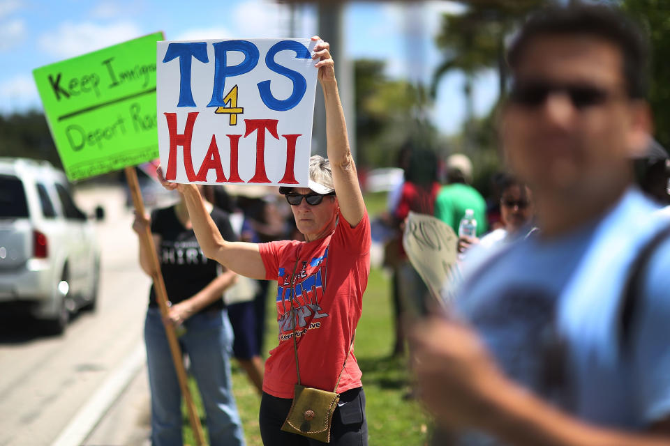 Protesters gather in front of the U.S. Citizenship and Immigration Services office in Broward County, Florida, on May 21 to urge the Department of Homeland Security to extend temporary protected status for Haitian immigrants. (Photo: Joe Raedle/Getty Images)