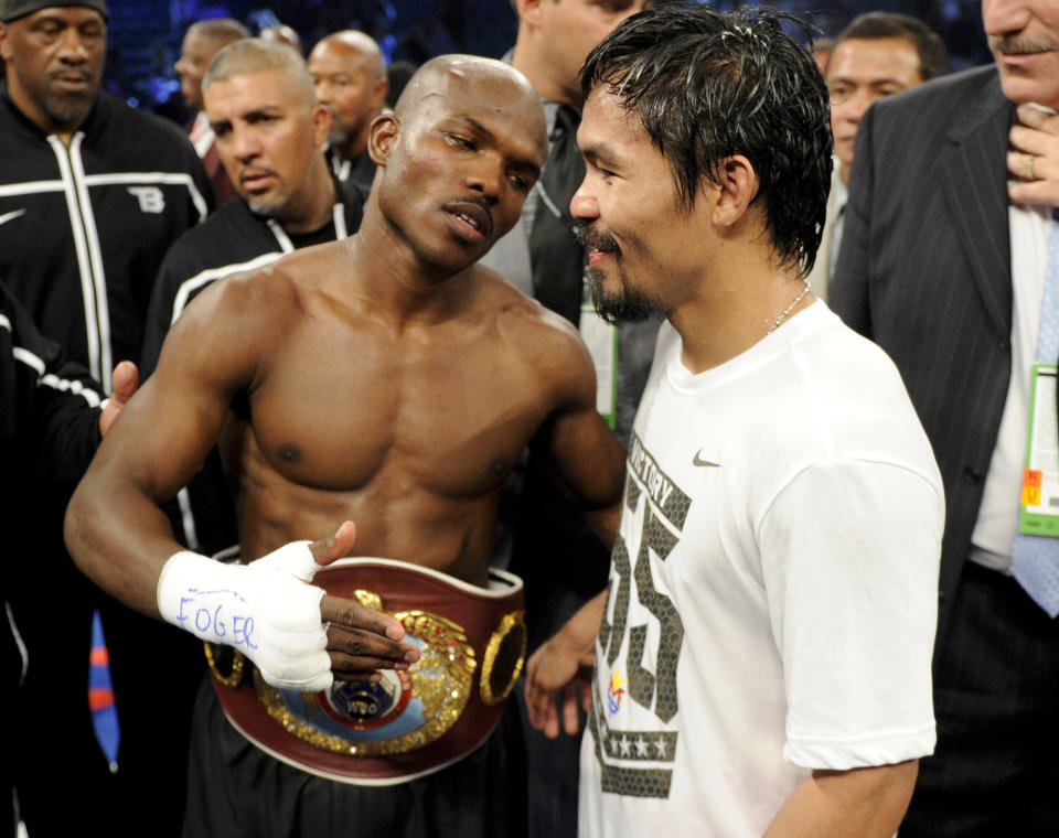 Timothy Bradley, from Palm Springs, Calif., left, talks with Manny Pacquiao, from the Philippines, following their WBO welterweight title fight Saturday, June 9, 2012, in Las Vegas. Bradley won the fight by split decision. (AP Photo/Chris Carlson)