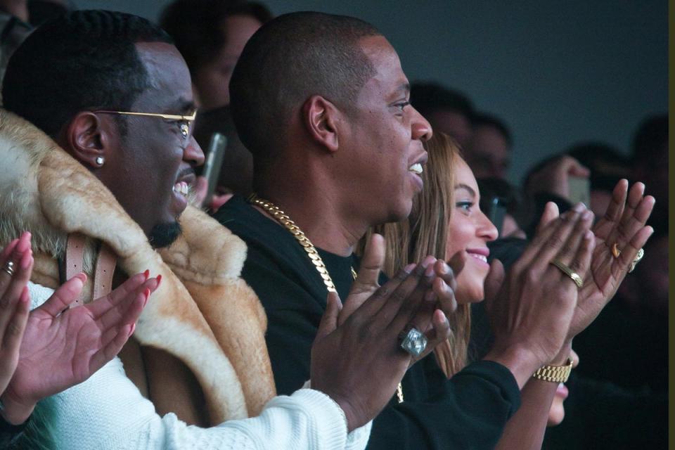 Hip hip hooray: Sean Combs, Jay Z, and Beyonce applaud Kanye at the end of the show (Picture: AP Photo/Bebeto Matthews) (AP Photo/Bebeto Matthews)