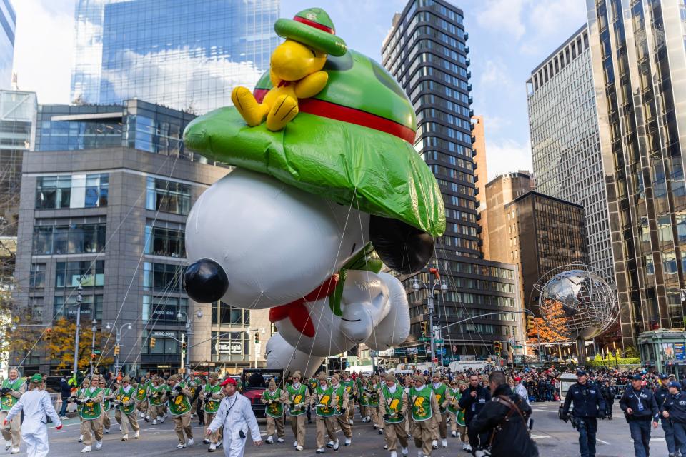 A view of the Snoopy balloon with a green hat during the 2023 Macy's Thanksgiving Day Parade