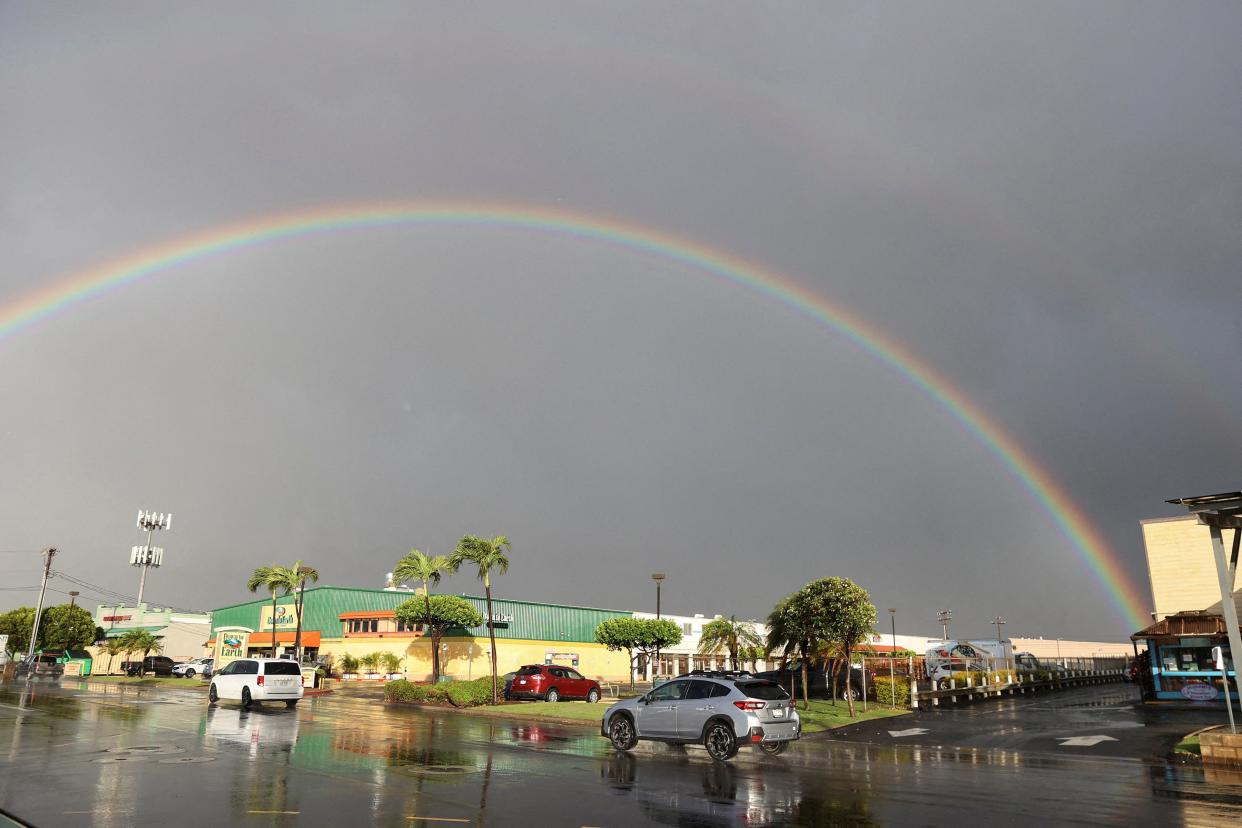 A rainbow can be seen as rain falls over Maui in Kahului (REUTERS)