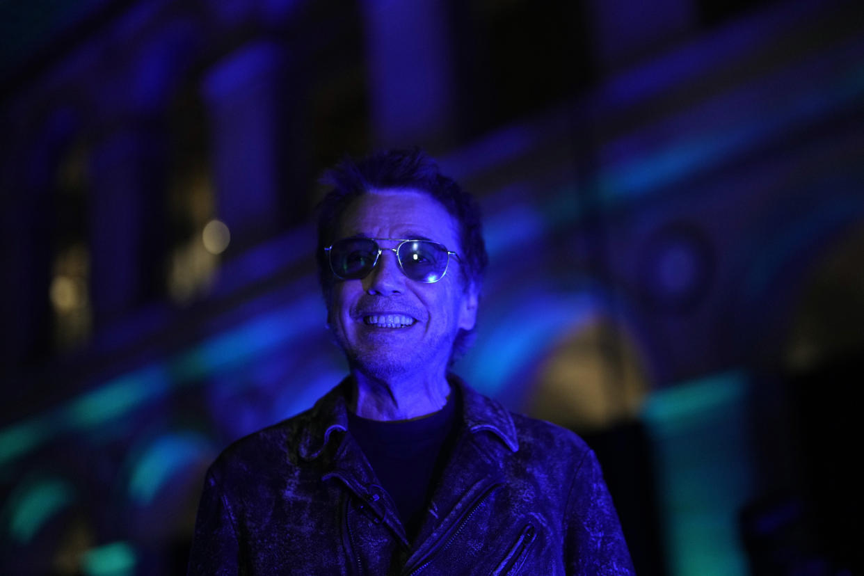 French electronic music performer Jean-Michel Jarre smiles during an interview with Associated Press, in Paris, Tuesday, Oct. 25, 2022. Genes — and a dash of humility — are the secrets of longevity for one of France's biggest music stars, Jean-Michel Jarre, the septuagenarian electronic music pioneer who's sold over 85 million records and is still going strong. (AP Photo/Thibault Camus)