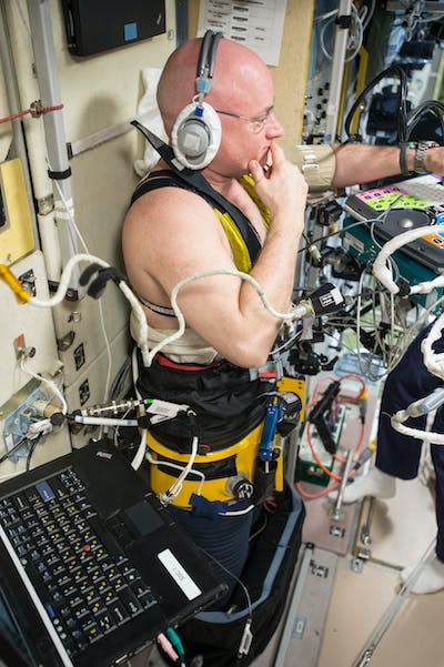 NASA astronaut Scott Kelly, pictured here, is wearing the Chibis lower body negative pressure suit, which may help counteract the negative effects of gravity-caused fluid shifts in the body. <a href="https://www.nasa.gov/mission_pages/station/research/news/b4h-3rd/hh-dressing-astronauts-for-return" rel="nofollow noopener" target="_blank" data-ylk="slk:NASA;elm:context_link;itc:0;sec:content-canvas" class="link ">NASA</a>