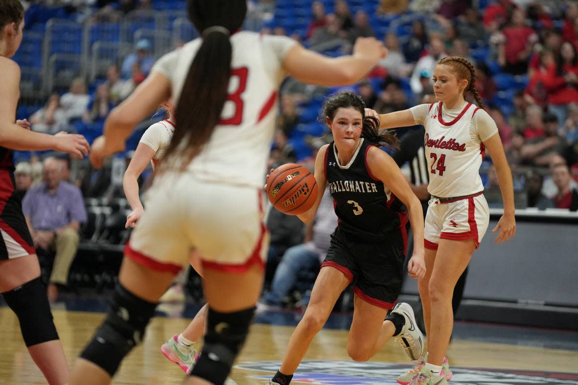 Shallowater’s Carli Buckley (3) drives to the basket with Claire Harris (24) and Kyra Anderson (33) defending for Huntington in the Class 3A state championship game on Saturday, March 2, 2024 at the Alamodome in San Antonio, Texas. Shallowater defeated Huntington 54-49 in OT.