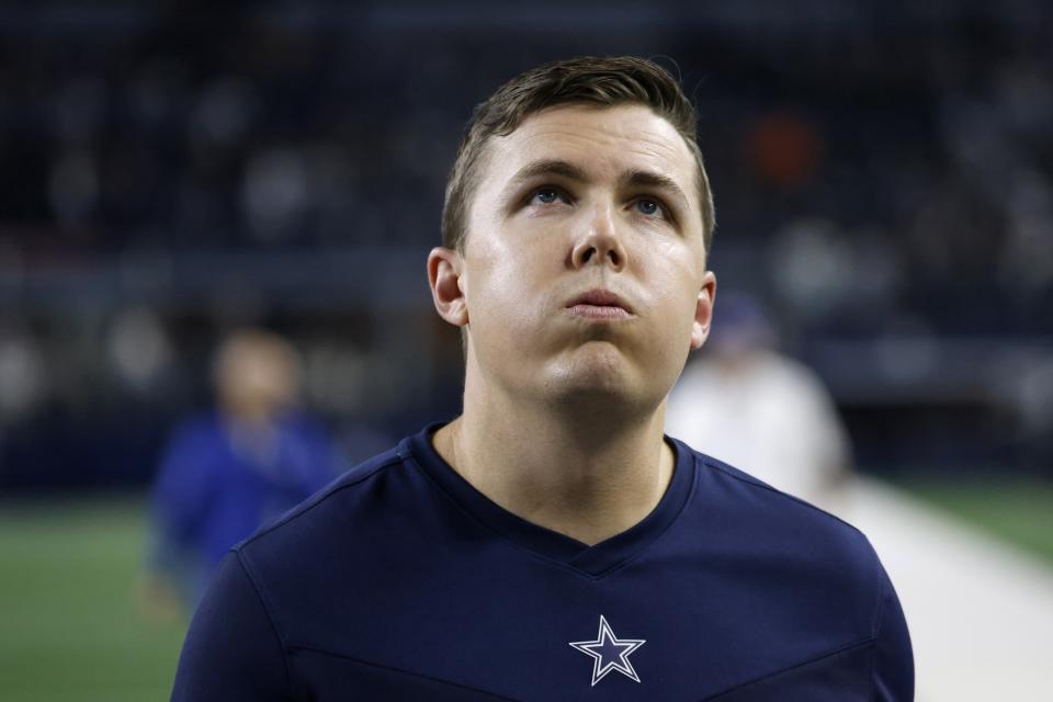 Dallas Cowboys offensive coordinator Kellen Moore walks off the field after an overtime loss to the Las Vegas Raiders in an NFL football game in Arlington, Texas, Thursday, Nov. 25, 2021. (AP Photo/Ron Jenkins)