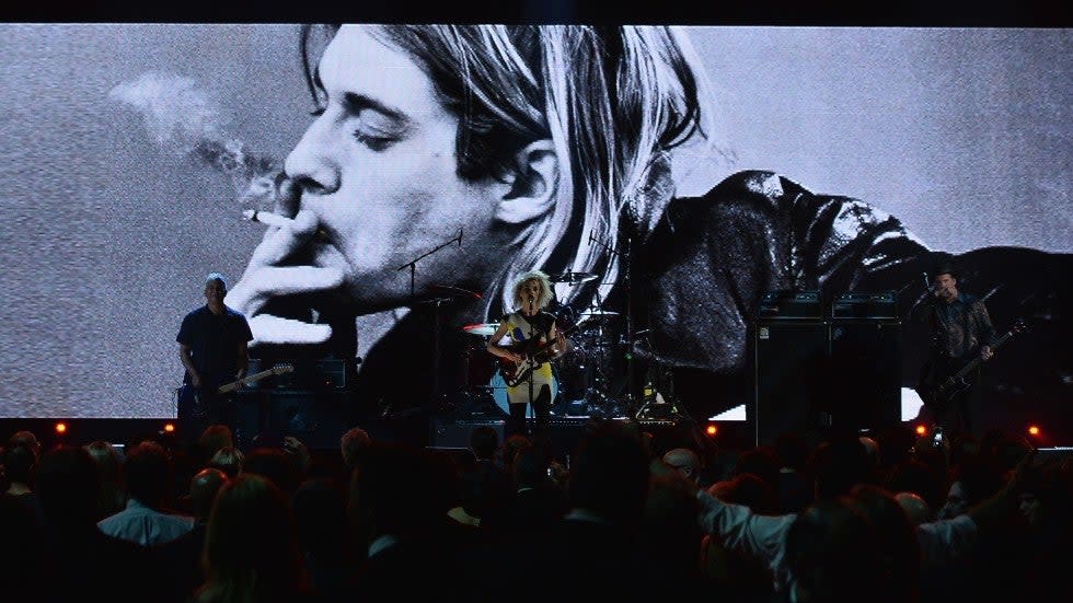 Pat Smear, St. Vincent and Krist Novoselic of Nirvana perform onstage at the 2014 Rock and Roll Hall Of Fame induction ceremony at Barclays Center in New York