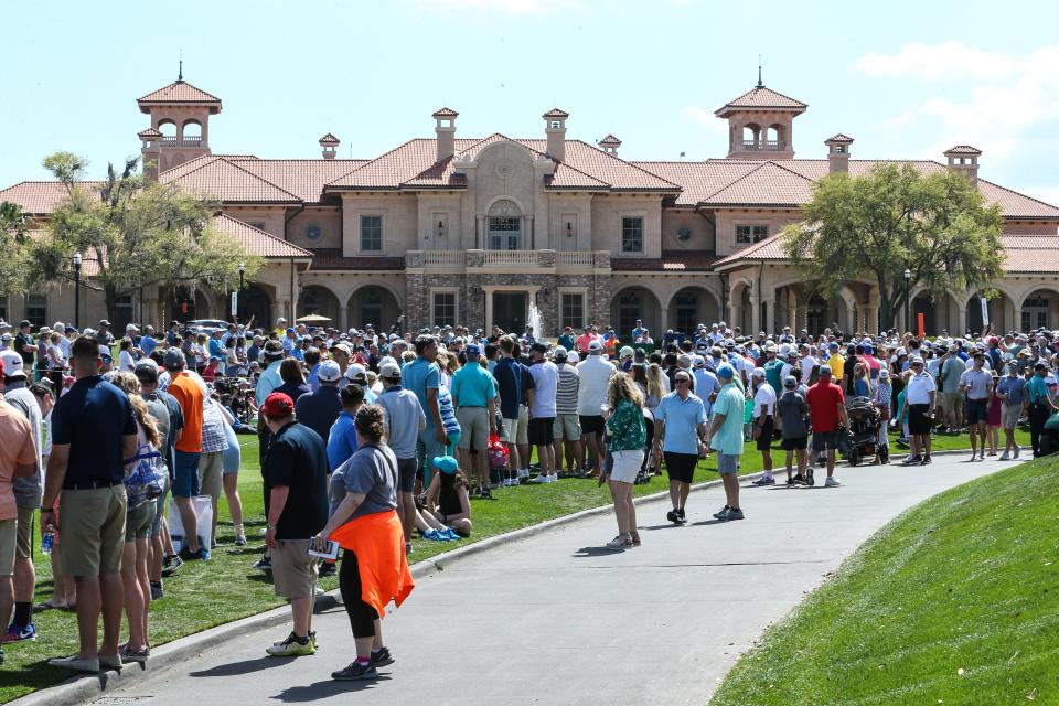Fans gather at the first tee of the Players Stadium Course. The public parking for Friday is sold out and other days may follow before tournament week arrives.