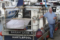 Fisherman Stan Rennie is pictured by his fishing vessel in Hartlepool, England, Thursday June. 27, 2024. A lot of politicians have promised change to voters in Hartlepool, a wind-whipped port town in northeast England. “At the last election I voted Conservative because Johnson promised our waters back — and lied through his teeth,” said Stan Rennie, a fisherman who has caught lobster off Hartlepool for five decades but says he can scarcely scrape a living anymore. (AP Photo/Scott Heppell)