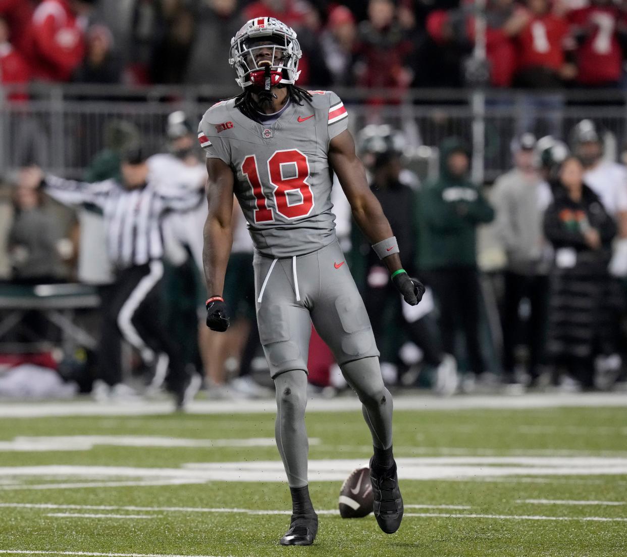 Nov. 11, 2023; Columbus, Oh., USA; 
Ohio State Buckeyes wide receiver Marvin Harrison Jr. (18) celebrates catching a long pass during Saturday's NCAA Division I football game against the Michigan State Spartans at Ohio Stadium.