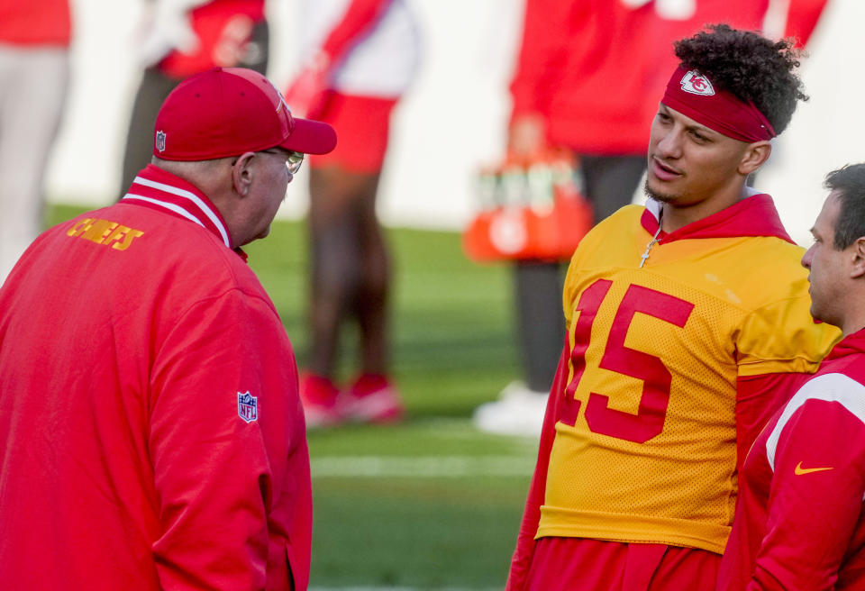 Kansas City Chiefs quarterback Patrick Mahomes (15), right, talks to Kansas City Chiefs head coach Andy Reid during a practice session in Frankfurt, Germany, Friday, Nov. 3, 2023. The Kansas City Chiefs are set to play the Miami Dolphins in a NFL game in Frankfurt on Sunday Nov. 5, 2023. (AP Photo/Michael Probst)