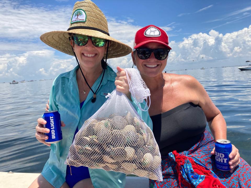 From the left, Ansley Martin and Carolyn Nance with a haul of bay scallops. COURTESY PHOTO