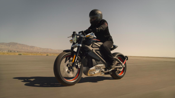 A person rides a Harley-Davidson Project LiveWire electric motorcycle