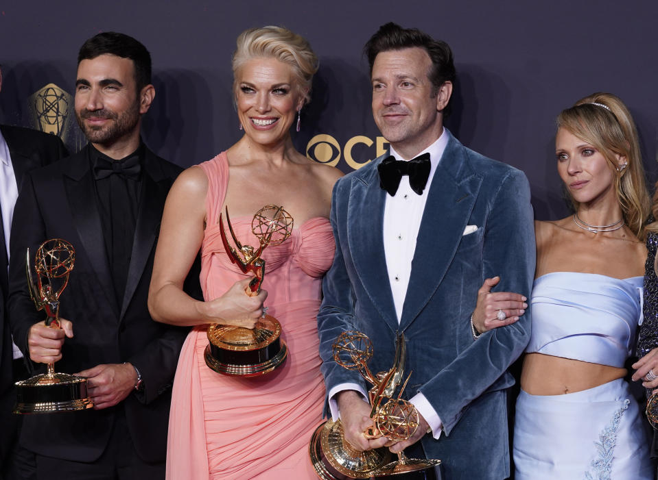 Brett Goldstein, from left, Hannah Waddingham, Jason Sudeikis and Juno Temple pose with their award for outstanding supporting actor in a comedy series, outstanding supporting actress in a comedy series, outstanding lead actor in a comedy series and outstanding comedy series for "Ted Lasso" at the 73rd Primetime Emmy Awards on Sunday, Sept. 19, 2021, at L.A. Live in Los Angeles. (AP Photo/Chris Pizzello)