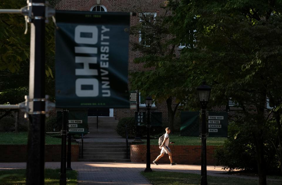 Students walk on the Ohio University Campus on College Green in Athens, Ohio.