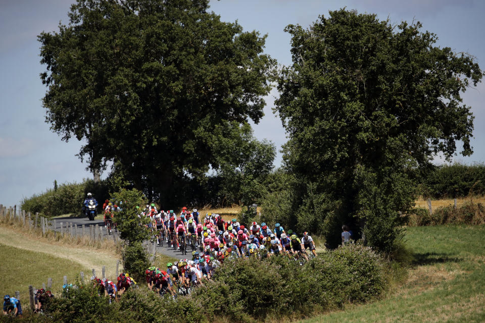 The pack rides during the tenth stage of the Tour de France cycling race over 217 kilometers (135 miles) with start in Saint-Flour and finish in Albi, France, Monday, July 15, 2019. (AP Photo/ Christophe Ena)
