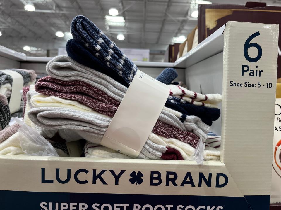 Six pairs of socks in white box at Costco