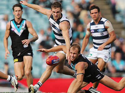 Joel Selwood of the Cats competes for the ball with Matt Thomas of the Power during the round nine AFL match between Port Adelaide Power and the Geelong Cats at AAMI Stadium on May 25, 2013 in Adelaide, Australia.