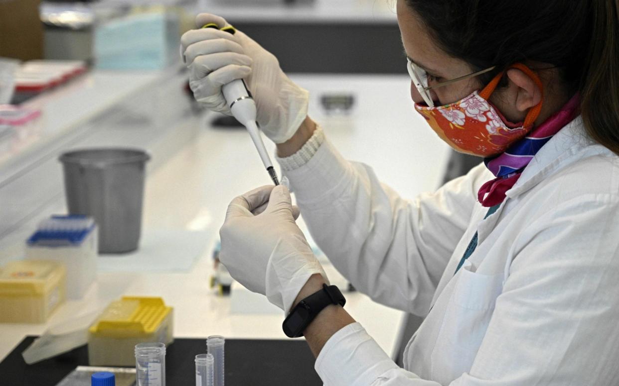 A scientist works at the mAbxience biosimilar monoclonal antibody laboratory plant in Garin, Buenos Aires province - JUAN MABROMATA /AFP