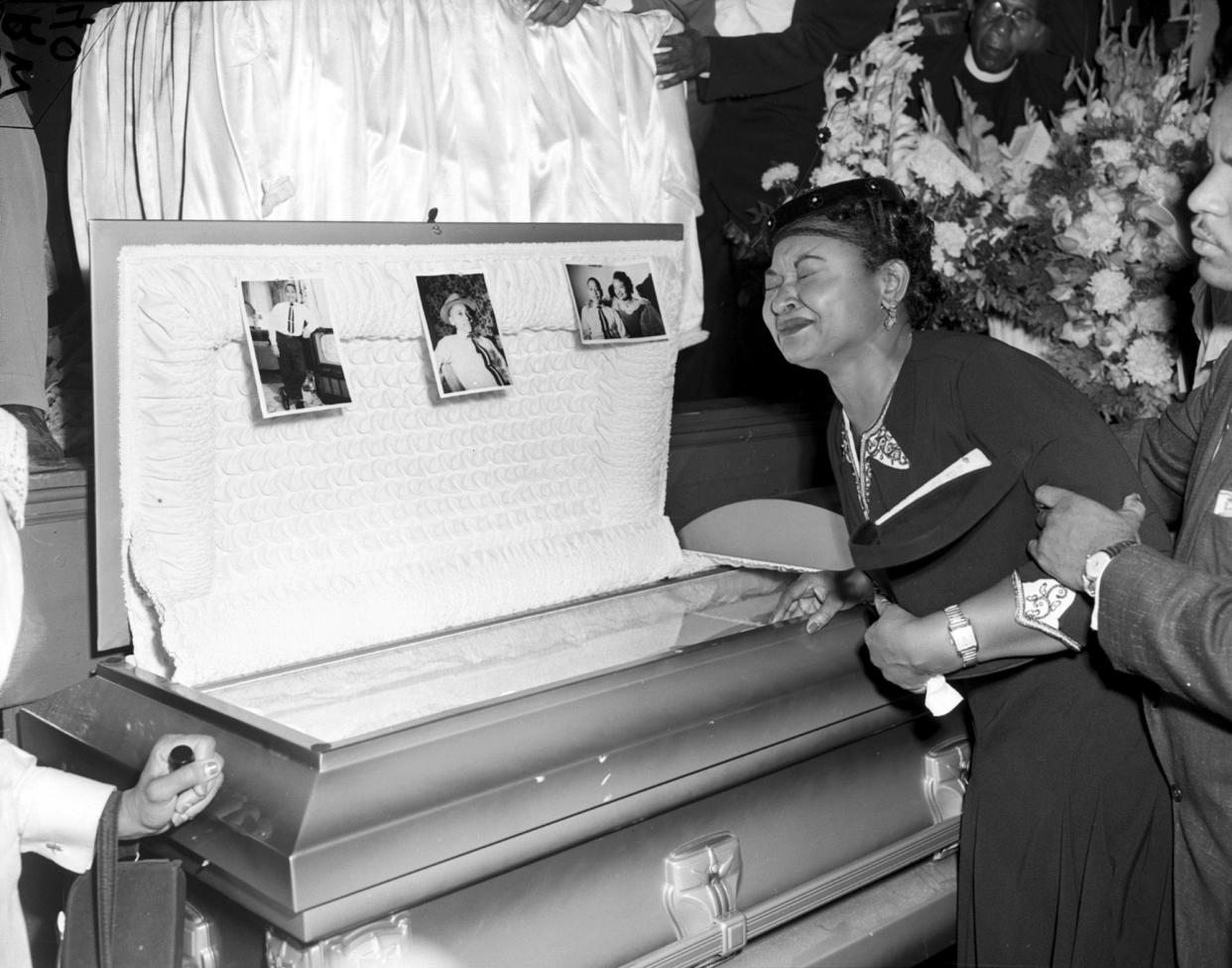 Mamie Till Mobley, Emmett's mother, weeps at her son's funeral on Sept. 6, 1955, in Chicago. She insisted that her son's body be displayed in an open casket forcing the nation to see the brutality directed at Blacks in the South at the time. 