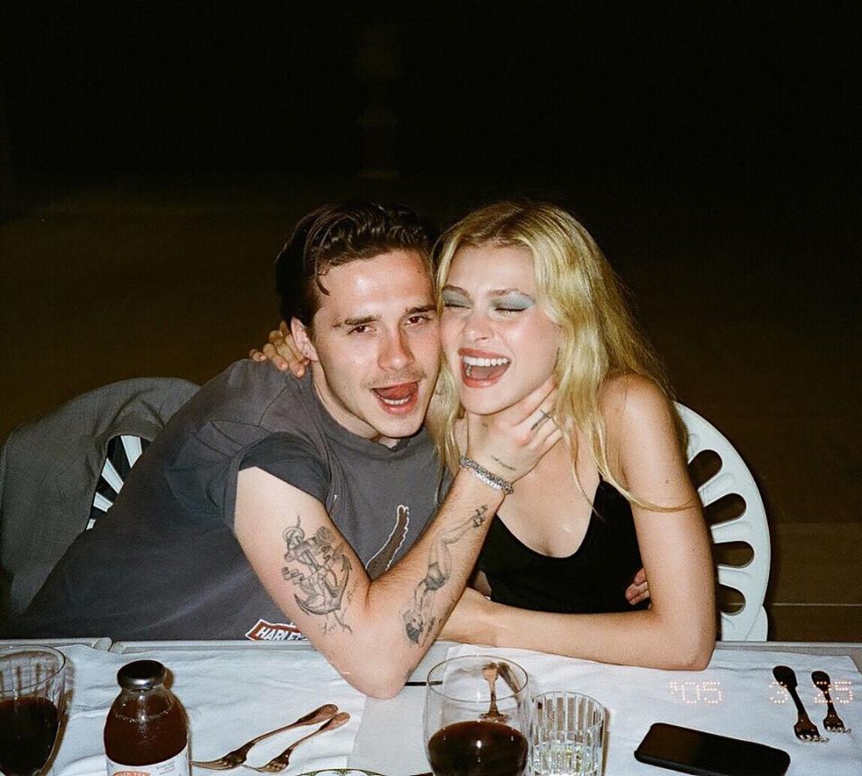 Brooklyn Beckham has been called out by a domestic violence charity after a picture shared on Instagram showed him holding fiancée Nicola Peltz's neck. Photo: Instagram/nicolaannepeltz