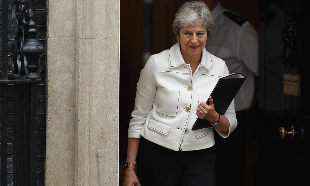 Theresa May leaves Downing Street on 15 October.