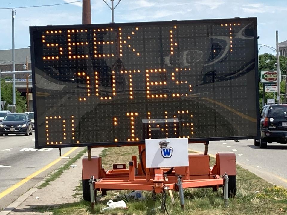Sign asking motorists to seek alternate routes with the closing of roadways for utility and street improvement projects.