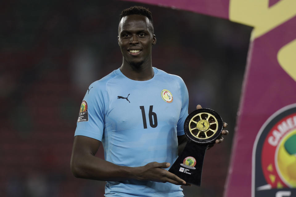 FILE - Senegal's goalkeeper Edouard Mendy poses with his best goalkeeper of the tournament awards after winning the African Cup of Nations 2022 final soccer match against Egypt at the Olembe stadium in Yaounde, Cameroon, Sunday, Feb. 6, 2022. (AP Photo/Sunday Alamba, File)