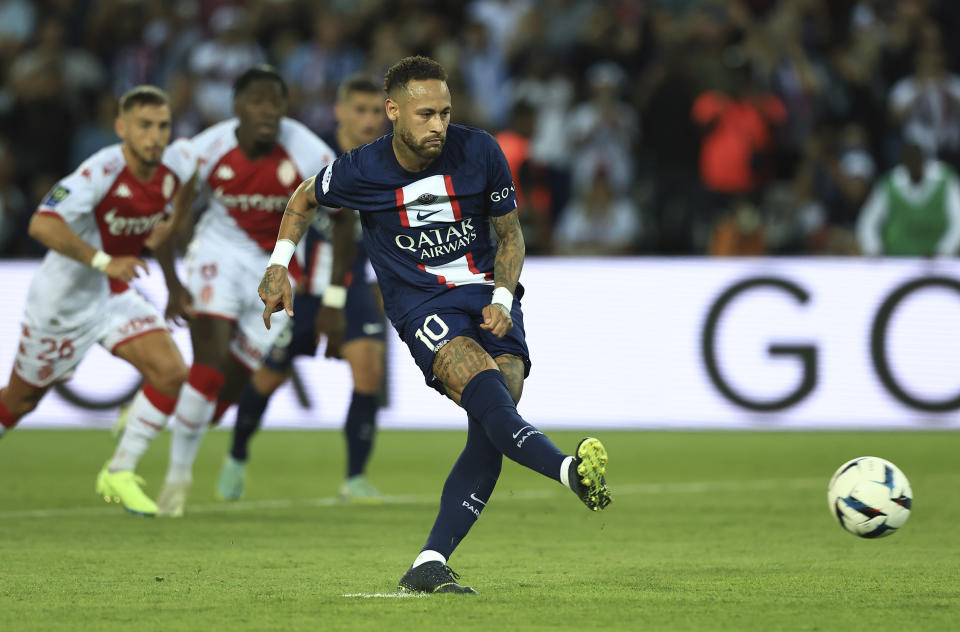 PSG's Neymar scores on a penalty kick during the French League One soccer match between Paris Saint-Germain and Monaco at the Parc des Princes in Paris, France, Sunday, Aug. 28, 2022. (AP Photo/Aurelien Morissard)