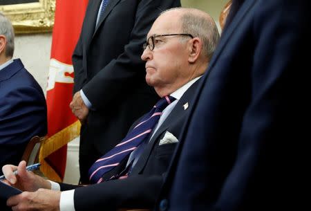 White House economic adviser Larry Kudlow takes notes during a meeting between U.S. President Donald Trump and China's Vice Premier Liu He in the Oval Office at the White House in Washington, U.S., February 22, 2019. REUTERS/Carlos Barria