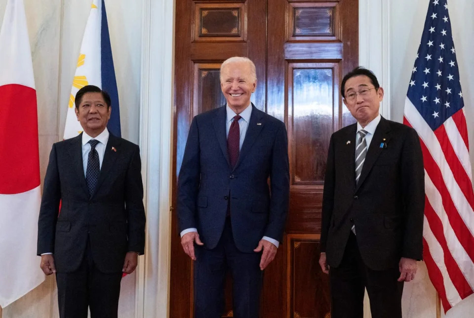 US President Joe Biden speaks to the press with Japanese prime minister Fumio Kishida (R) and Filipino president Ferdinand Marcos Jr. (L) ahead of a trilateral meeting at the White House in Washington, DC, on 11 April 2024 (AFP via Getty Images)