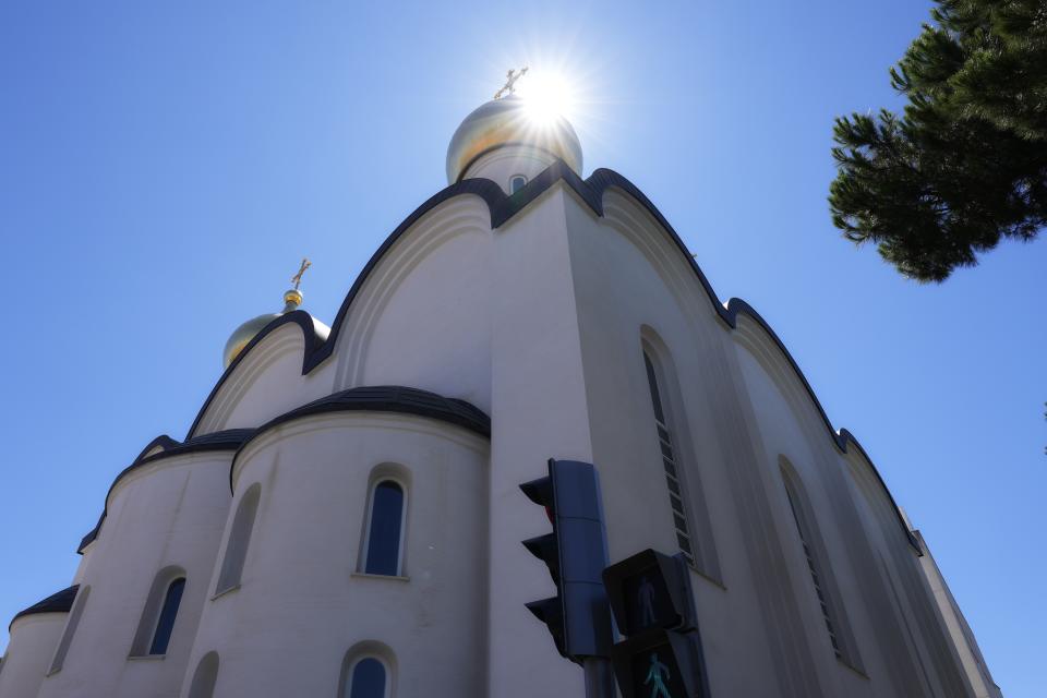 The sun shines behind the Russian Cathedral of Saint Mary Magdalene, where the Rev. Andrei Kordochkin serves in Madrid, Spain, Saturday, July 15, 2023. The Rev. Andrei Kordochkin, the priest in the church, was suspended by Moscow's Partiarch Kirill after he condemned the Kremlin's decision to send troops to Ukraine. Church officials said Kordochkin was punished for "inciting hatred" among his parishioners, but the priest argues it's a warning to dissuade him from further criticism. (AP Photo/Paul White)