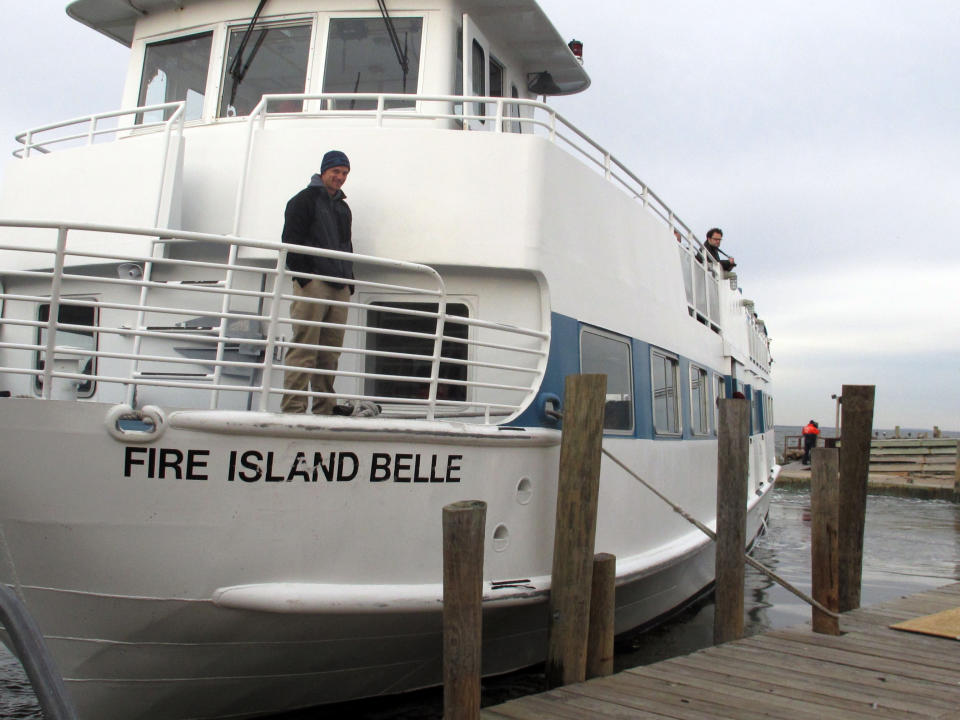 In this Friday, Nov. 16, 2012 photo, the ferry Fire Island Belle leaves the dock with passengers visiting Ocean Beach, N.Y. Residents of the Fire Island community were allowed to visit to assess damage from Superstorm Sandy. (AP Photo/Frank Eltman)