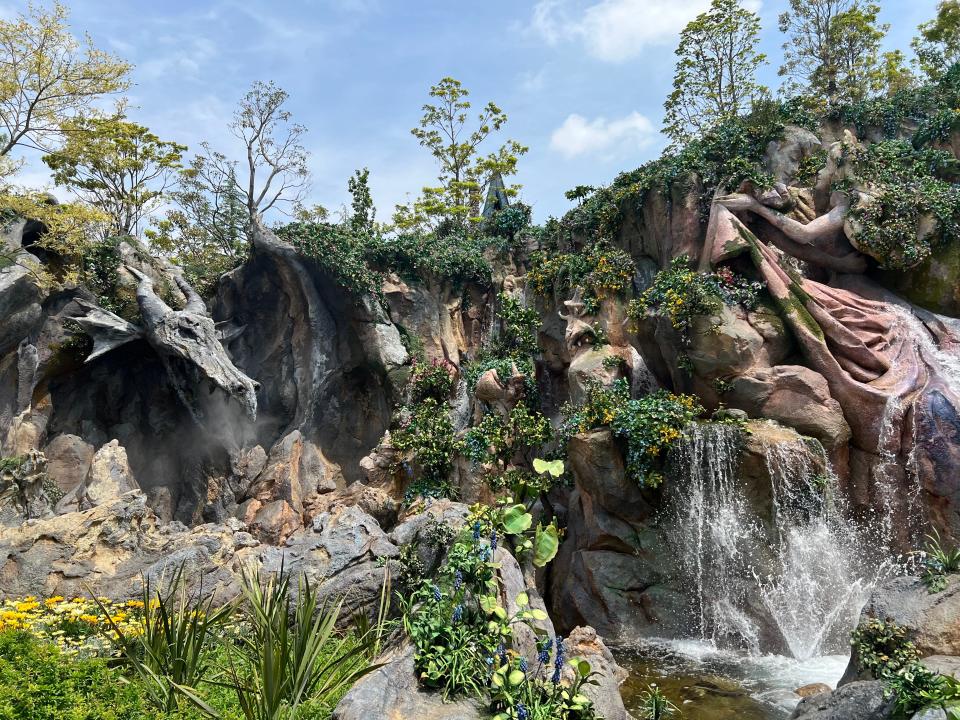 Maleficent keeps a watchful eye on Sleeping Beauty and Prince Phillip in the rockwork at Fantasy Springs. The springs' magical waters are said to be able to bring Disney stories to life.