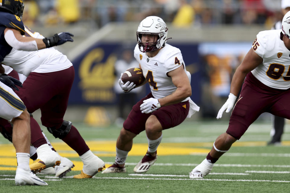 Arizona State running back Cameron Skattebo (4) runs against California during the first half of an NCAA college football game in Berkeley, Calif., Saturday, Sept. 30, 2023. (AP Photo/Jed Jacobsohn)