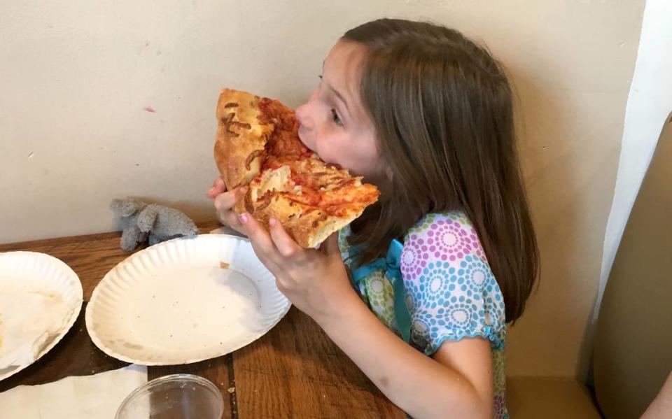 The pizza slices at Benny Pennello’s are bigger than your face.