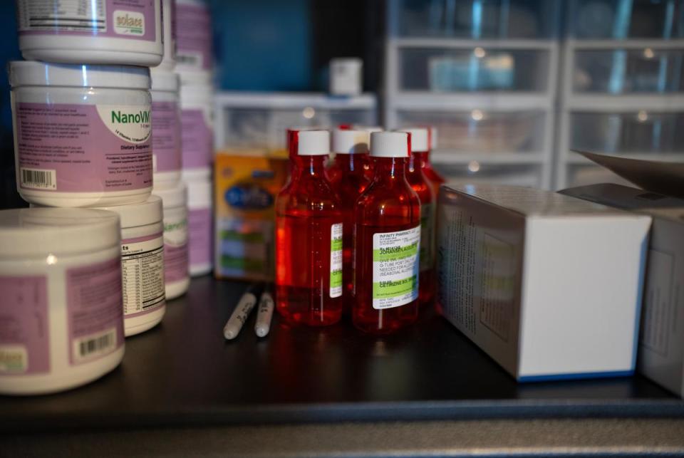 Medications and other medical supplies line a shelf in the "game room" of their home in McKinney, Texas on Dec. 9, 2023.