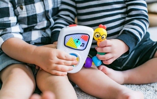 musical rainbow toy with little worm on side that plays music