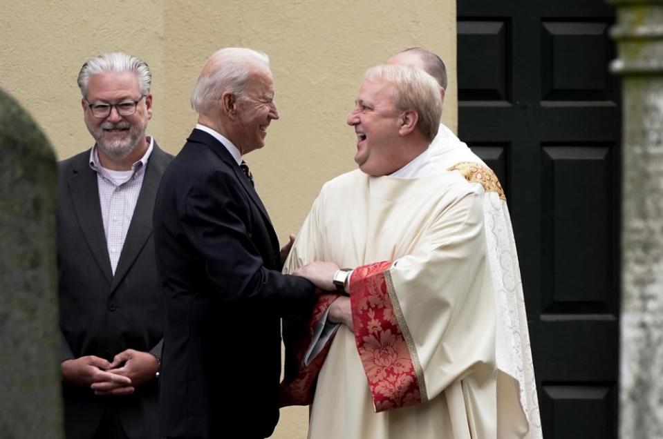 President Joe Biden speaks with a priest outside St Joseph on the Brandywine Catholic Church, in Wilmington, Delaware, on 30 May 2021.