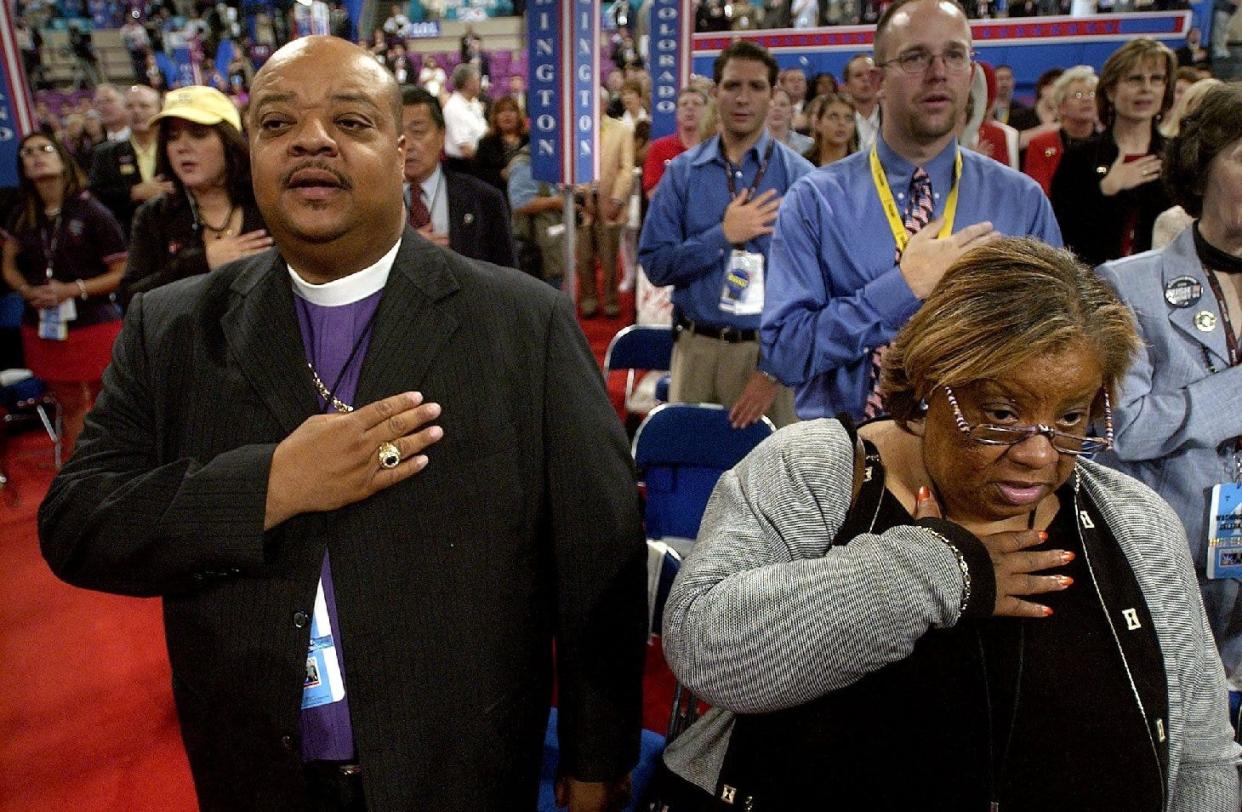 Sedgwick Daniels (left) and his sister Hattie Daniels-Rush recite the pledge of allegiance during the third night of the 2004 Republican National Convention in Madison Square Garden in New York City.