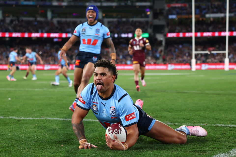 MELBOURNE, AUSTRALIA - JUNE 26: Latrell Mitchell of the Blues celebrates scoring a try during game two of the men's State of Origin series between New South Wales Blues and Queensland Maroons at the Melbourne Cricket Ground on June 26, 2024 in Melbourne, Australia. (Photo by Quinn Rooney/Getty Images)