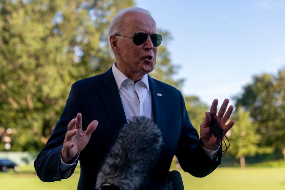 President Joe Biden stops to speak to members of the media as he arrives at the White House in Washington, Sunday, Sept. 26, 2021, after returning from a weekend at Camp David.