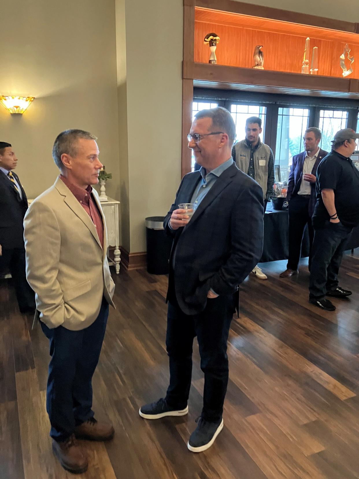 Republican gubernatorial candidate Eric Doden speaks with Greencastle Building Commissioner Patrick Thibodeau at a fundraiser in Putnam County.