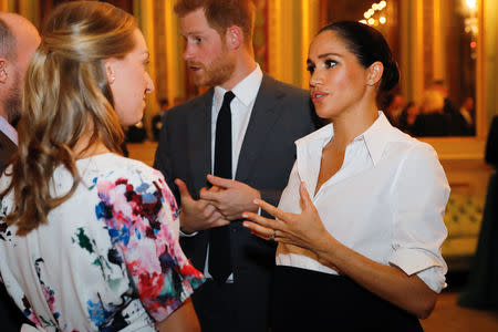 Britain's Prince Harry and Meghan, Duchess of Sussex, meet guests during a pre-ceremony reception before the Endeavour Fund Awards in the Drapers' Hall in London, Britain February 7, 2019. Tolga Akmen/Pool via REUTERS