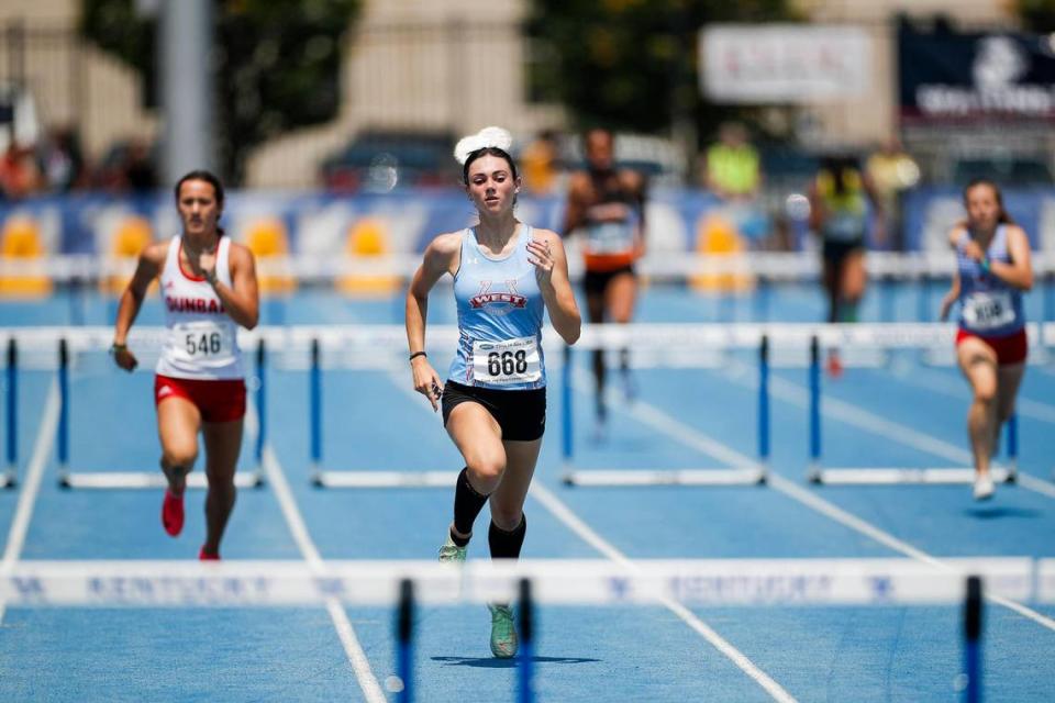 West Jessamine’s Aly Doyle races to first place in the 300-meter hurdles during the Class 3A Track and Field State Championships at the University of Kentucky Track and Field Facility on Saturday.