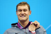 <a href="http://sports.yahoo.com/olympics/swimming/peter-vanderkaay-1135313/" data-ylk="slk:Peter Vanderkaay;elm:context_link;itc:0;sec:content-canvas" class="link ">Peter Vanderkaay</a> of the United States celebrates with his bronze medal during the medal ceremony for the Men's 400m Freestyle on Day One of the London 2012 Olympic Games at the Aquatics Centre on July 28, 2012 in London, England. (Photo by Al Bello/Getty Images)